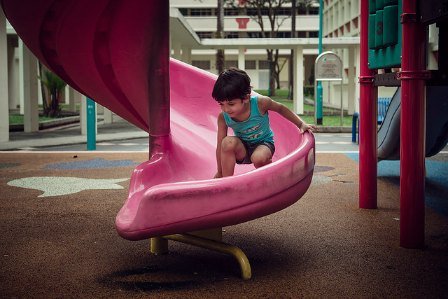 child playing on slide