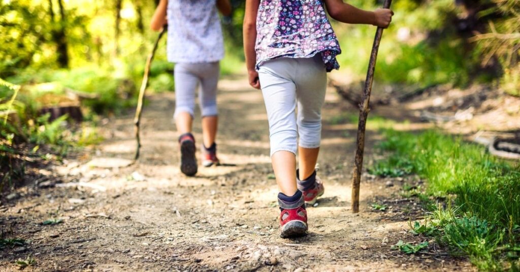 kids going on a hike, free and cheap things to do in the summer with kids