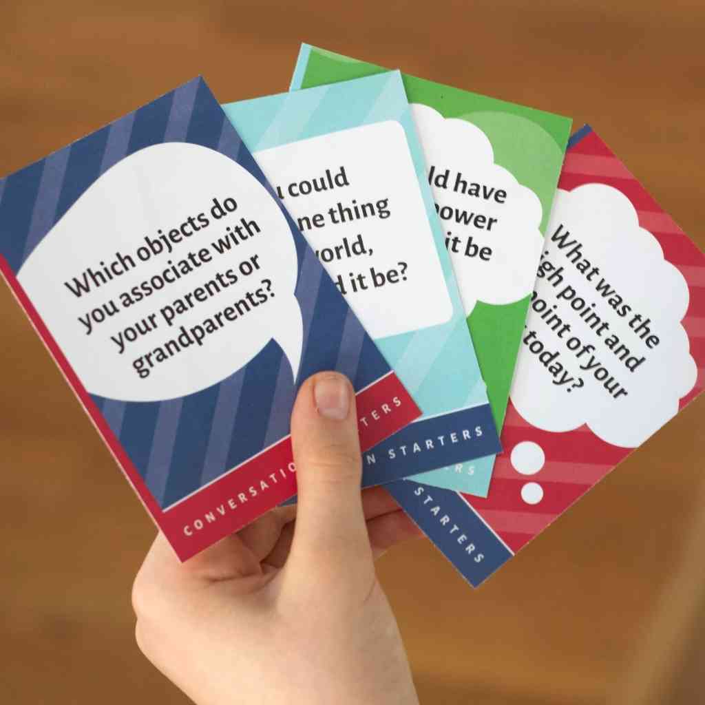 hand holding conversation starter cards