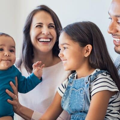 smiling family using positive parenting