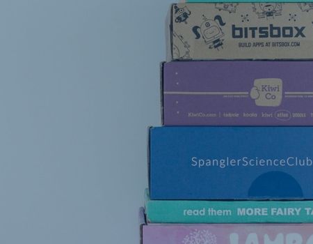 stacked boxes of educational subscription boxes