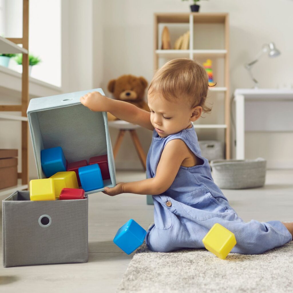 toddler playing with blocks independently